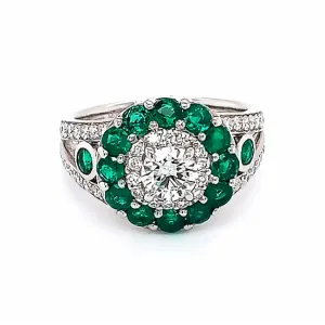 Platinum engagement ring with diamonds and emeralds