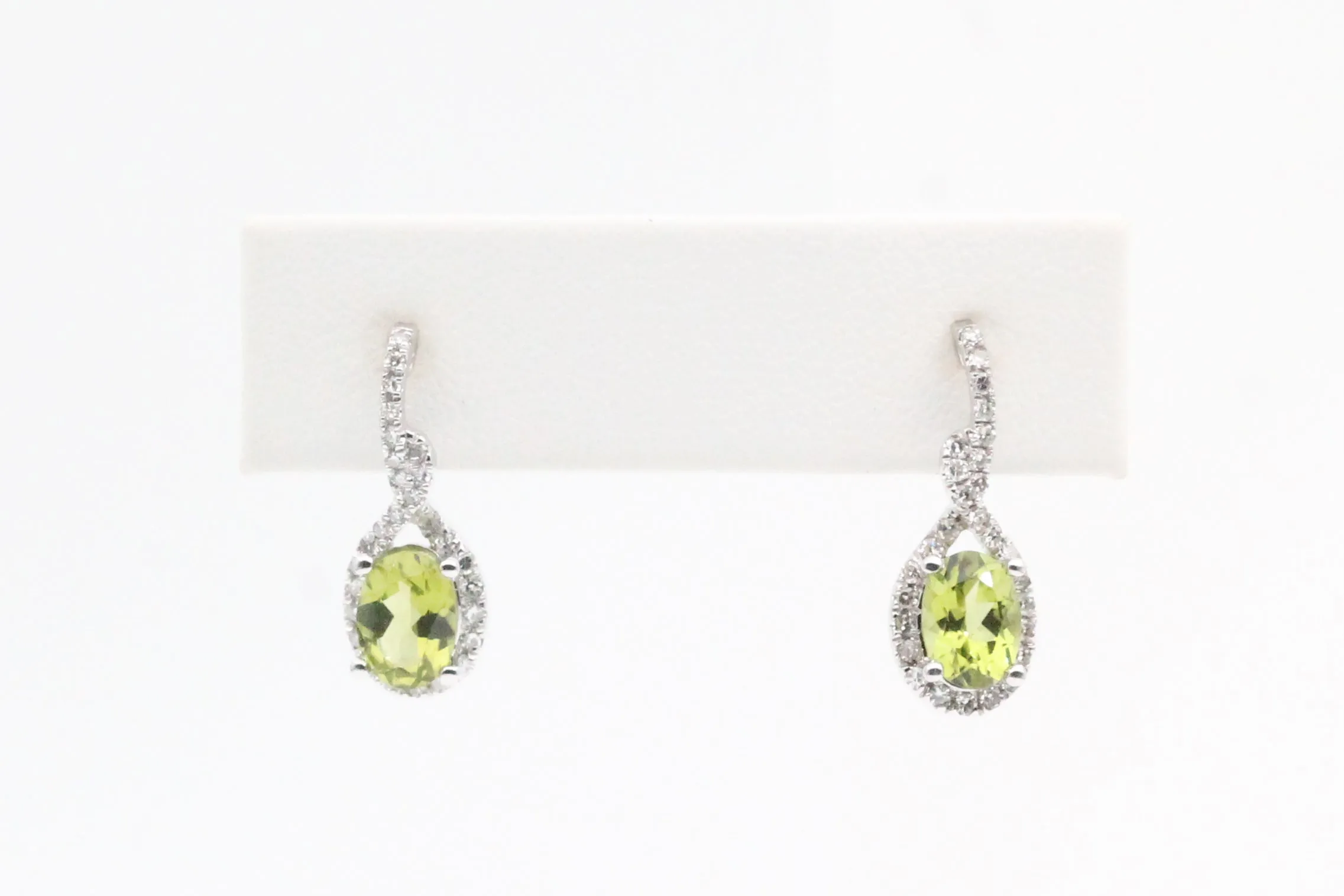 White Gold Peridot Twist Dangle Earrings